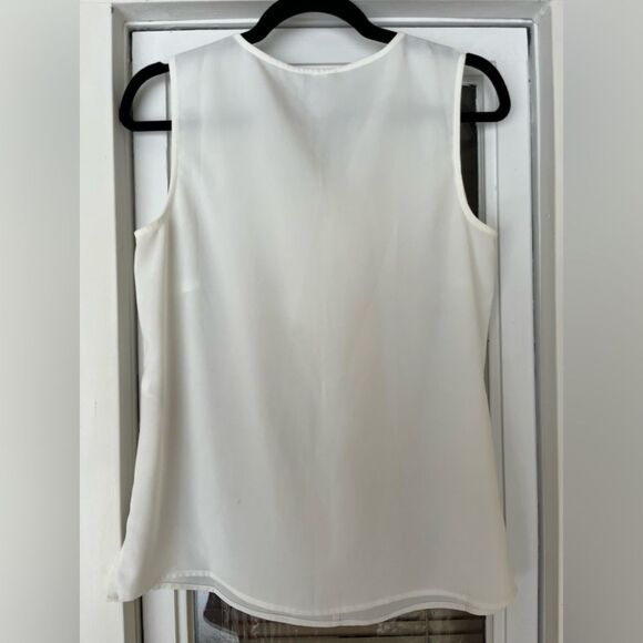 Chico’s white sleeveless v-neck blouse, jabot in front, slits at sides, size 0. - Picture 6 of 7